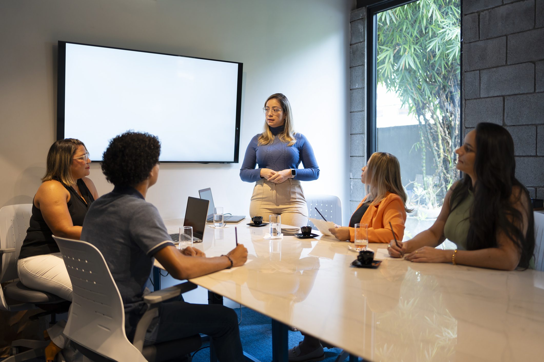 Team discussing strategies in office meeting