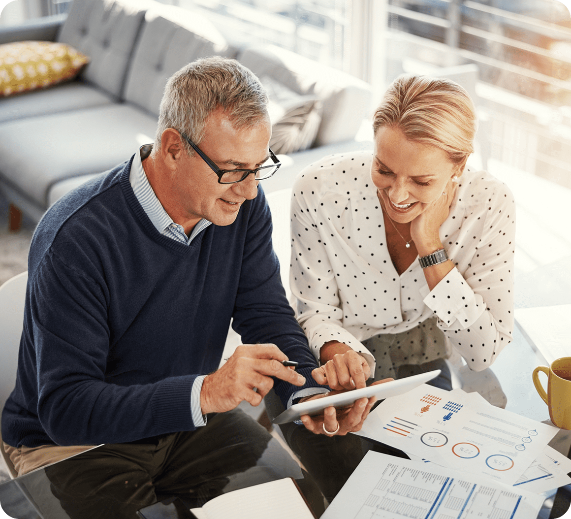Elderly couple reviewing financial documents