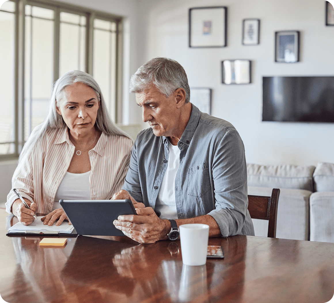 Mature couple discussing finances at home