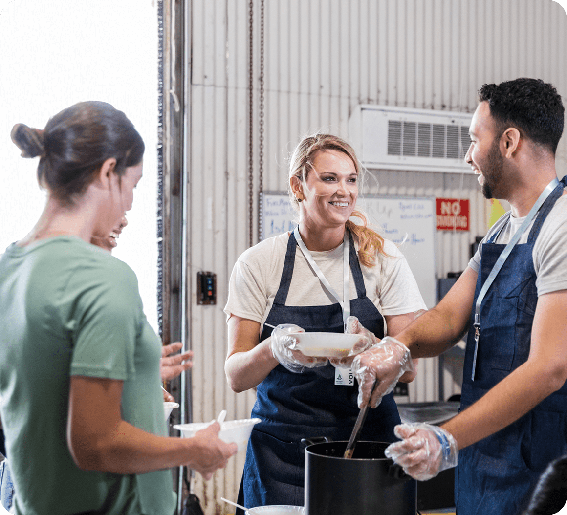 Group cooking together at a soup kitchen